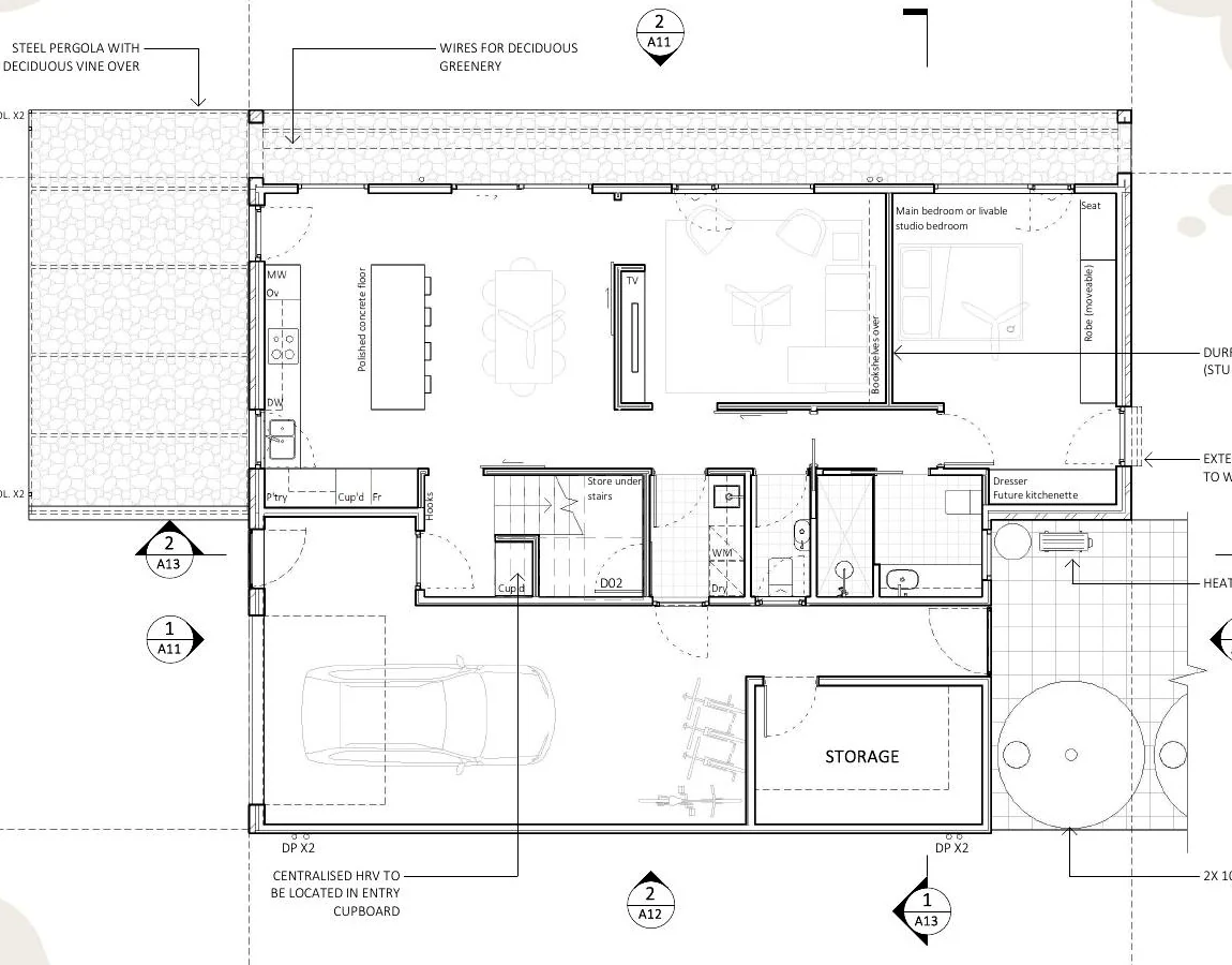 Ground-floor plan showing the adaptable bedroom suite, living areas, workshop and garden relationships